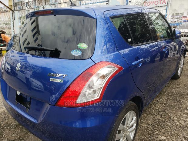 Teal 2015 Suzuki Swift - Pre-owned Compact Vehicle