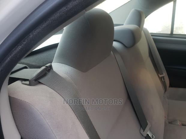 Experience the 2015 Toyota Axio in Ivory: Style and Performance