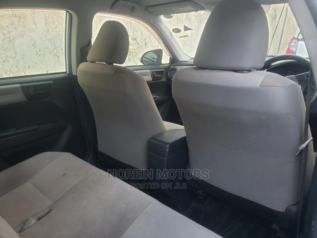 Experience the 2015 Toyota Axio in Ivory: Style and Performance