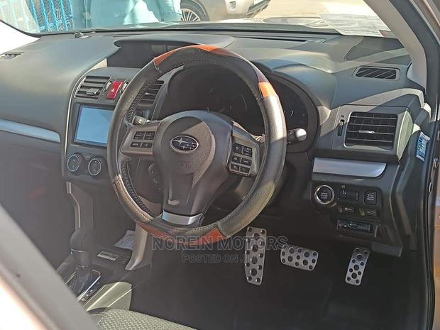 15 Subaru Forester in Gold offers all-wheel drive and a spacious interior. Test drive today!