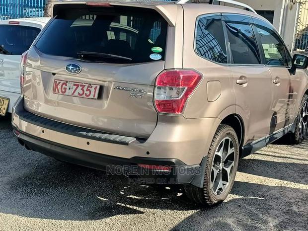 15 Subaru Forester in Gold offers all-wheel drive and a spacious interior. Test drive today!