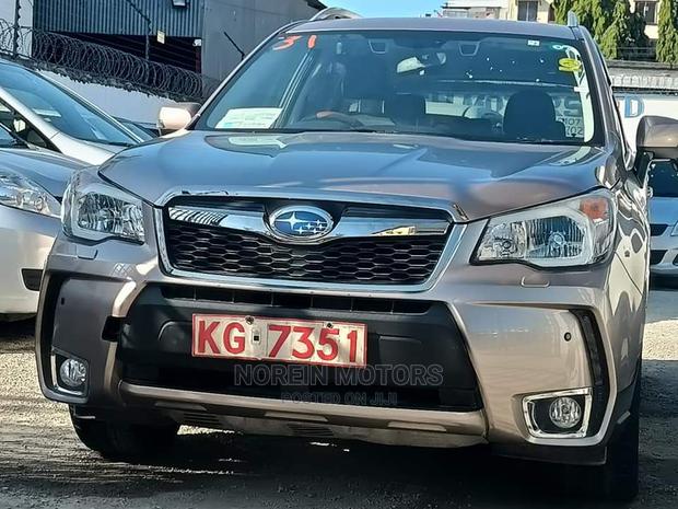 15 Subaru Forester in Gold offers all-wheel drive and a spacious interior. Test drive today!