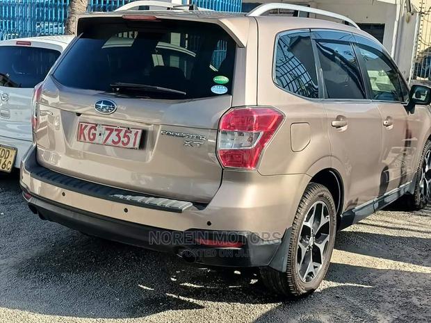 15 Subaru Forester in Gold offers all-wheel drive and a spacious interior. Test drive today!