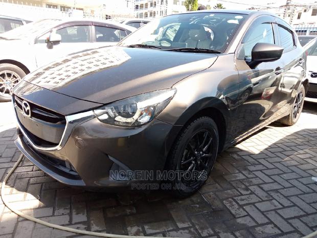 Brown Mazda Demio 2015: Stylish and Efficient Compact Car!