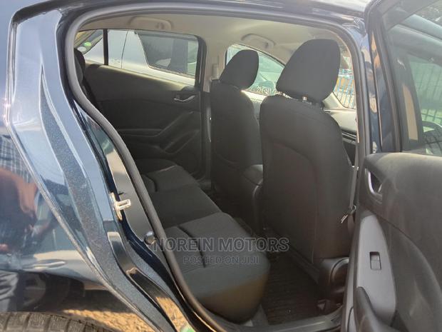Mazda Axela 2015 - Sleek Green Compact Sedan