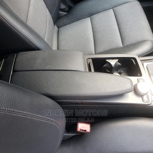 Off White 2014 Mercedes-Benz C180: Exquisite Luxury Sedan