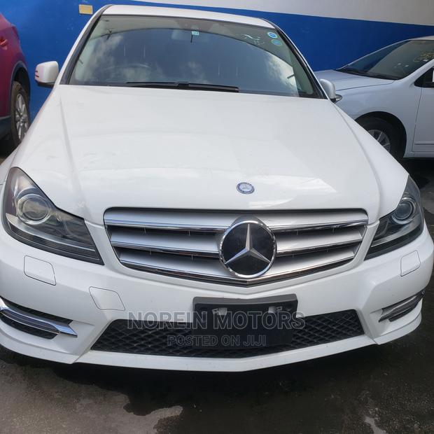 Off White 2014 Mercedes-Benz C180: Exquisite Luxury Sedan