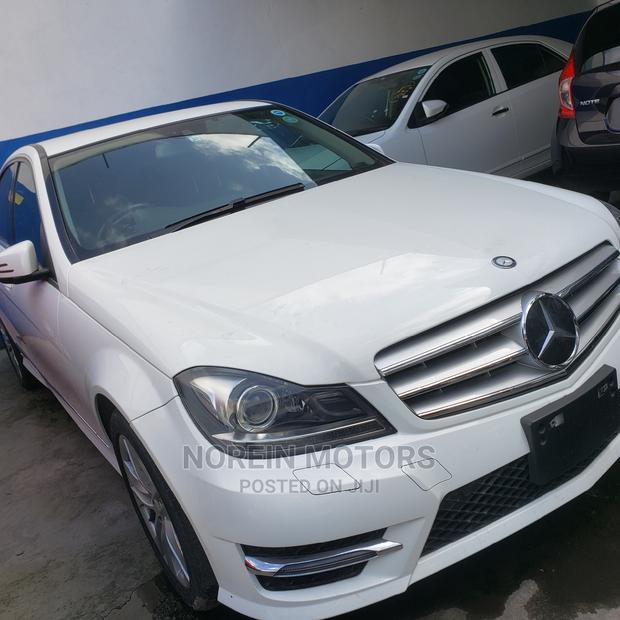 Off White 2014 Mercedes-Benz C180: Exquisite Luxury Sedan