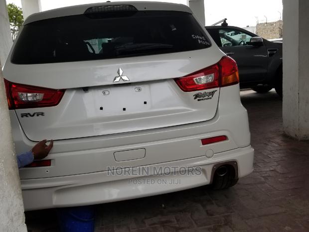 Off-White Mitsubishi RVR 2015 - Sleek and Spacious for Your Next Adventure!