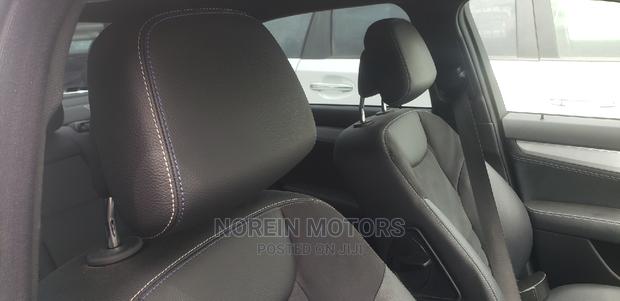 2014 Mercedes-Benz C180 Burgundy - Elegant Sedan with Power and Comfort