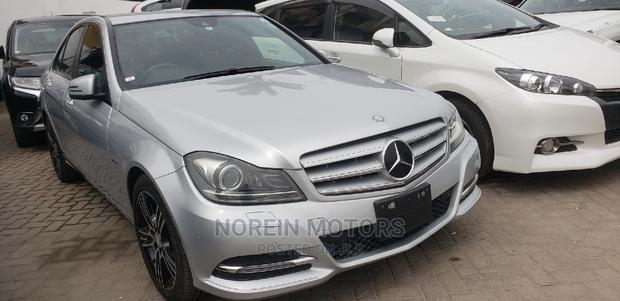 2014 Mercedes-Benz C180 Burgundy - Elegant Sedan with Power and Comfort