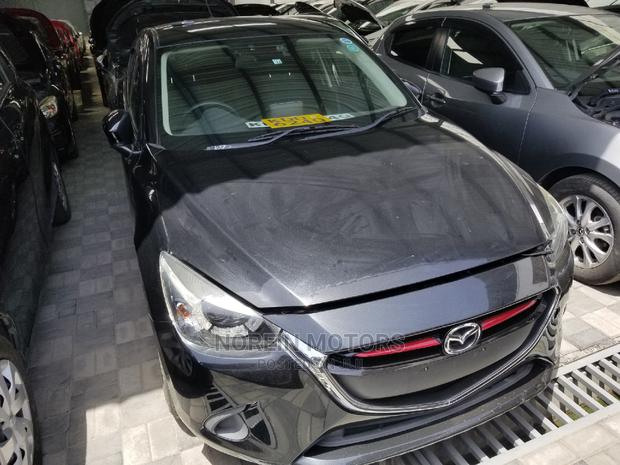 Used Brown Mazda Demio 2014 - Compact Car with Style and Comfort for Less