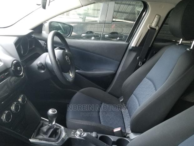 Used Brown Mazda Demio 2014 - Compact Car with Style and Comfort for Less