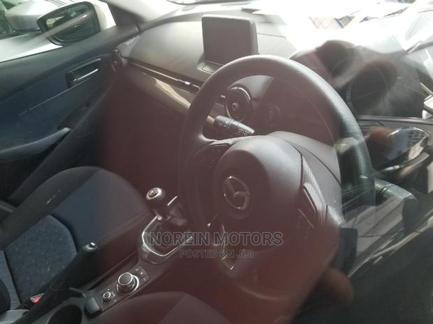Used Brown Mazda Demio 2014 - Compact Car with Style and Comfort for Less