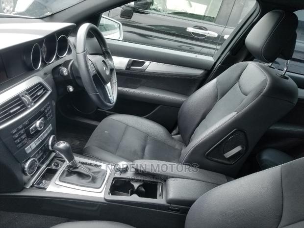 2014 Ivory Mercedes-Benz C180 - A Stylish Compact Sedan
