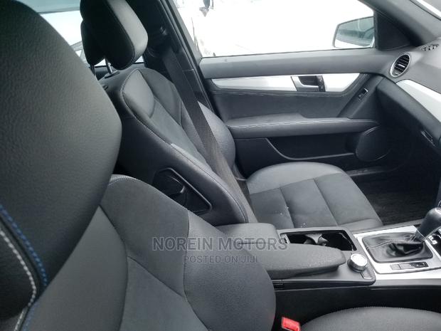 2014 Ivory Mercedes-Benz C180 - A Stylish Compact Sedan