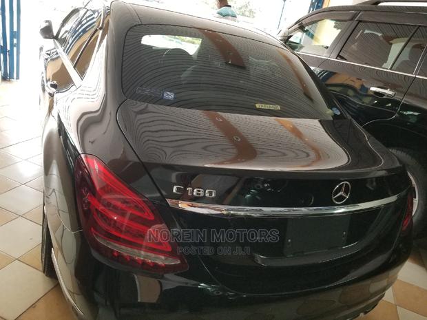 Pre-owned 2014 Mercedes-Benz C180 with Black Exterior