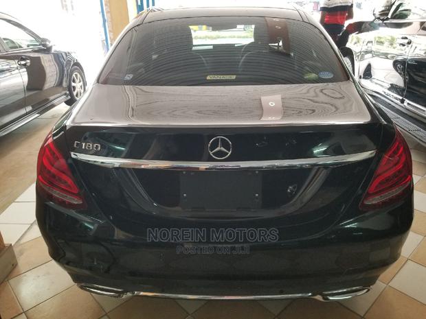 Pre-owned 2014 Mercedes-Benz C180 with Black Exterior