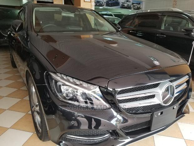 Pre-owned 2014 Mercedes-Benz C180 with Black Exterior
