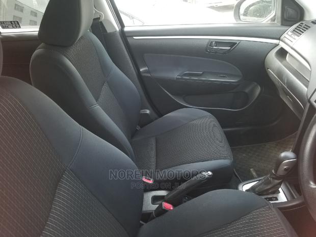 2014 Suzuki Swift Silver - Style, Comfort, and Power in One