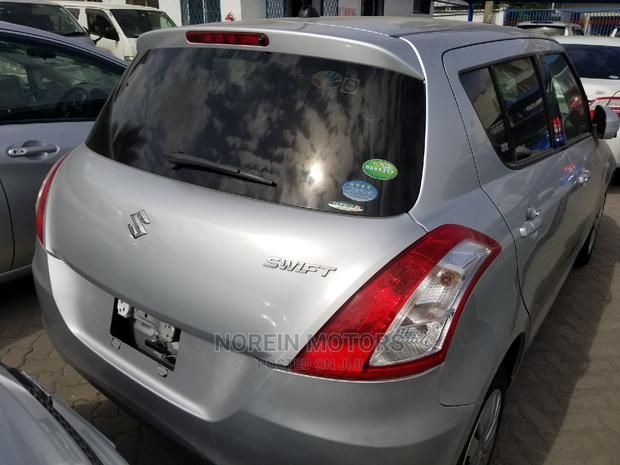 2014 Suzuki Swift Silver - Style, Comfort, and Power in One
