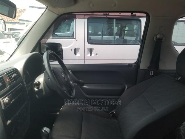 2014 Suzuki Jimny in White: Compact, Rugged, and Ready for Adventure