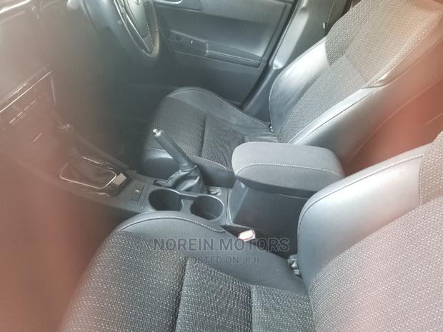 Red 2014 Toyota Auris: Quality Compact Car for a Great Price