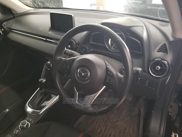 Ivory Mazda Demio 2014 - Compact Car, Big on Features and Style