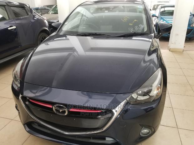 Ivory Mazda Demio 2014 - Compact Car, Big on Features and Style