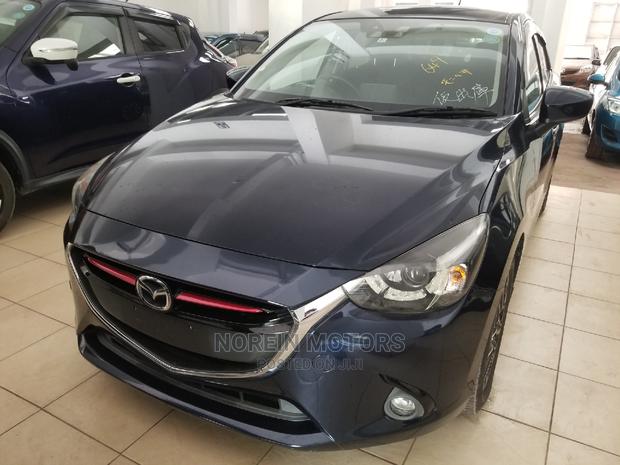 Ivory Mazda Demio 2014 - Compact Car, Big on Features and Style