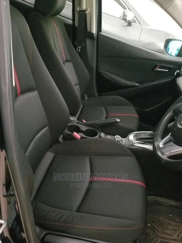 Ivory Mazda Demio 2014 - Compact Car, Big on Features and Style