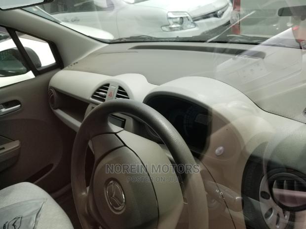 Pink Mazda Carol 2015: A Stylish Compact Choice
