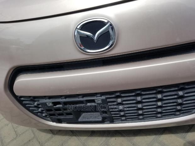 Pink Mazda Carol 2015: A Stylish Compact Choice