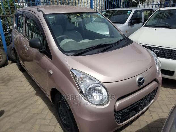 Pink Mazda Carol 2015: A Stylish Compact Choice