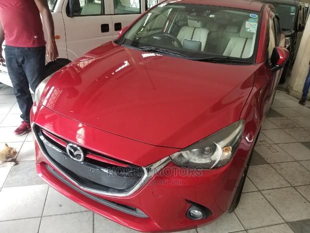 Red Mazda Demio 2014: Compact Car with Great Performance