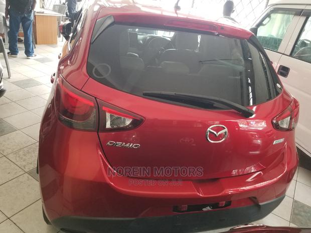 Red Mazda Demio 2014: Compact Car with Great Performance