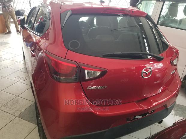 Red Mazda Demio 2014: Compact Car with Great Performance