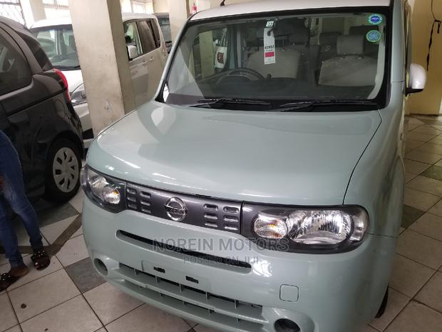 Green 2014 Nissan Cube: Compact Car with Style and Sustainability