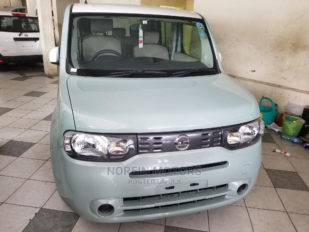 Green 2014 Nissan Cube: Compact Car with Style and Sustainability