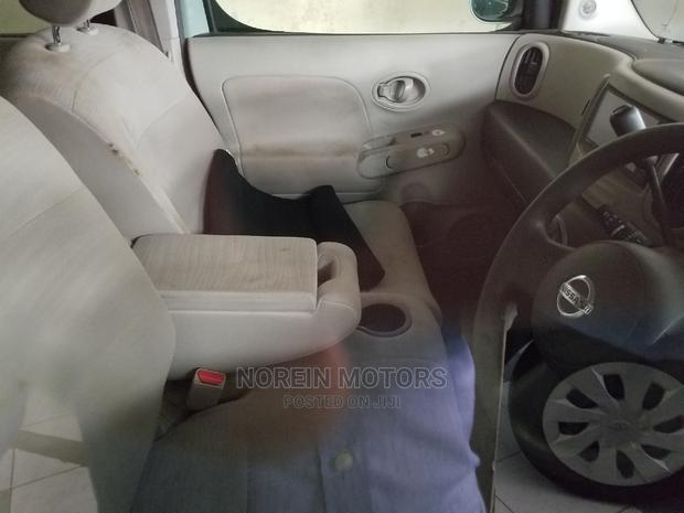 Green 2014 Nissan Cube: Compact Car with Style and Sustainability