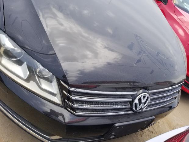 New 2014 Passat in Black: Stylish and Powerful Volkswagen Sedan