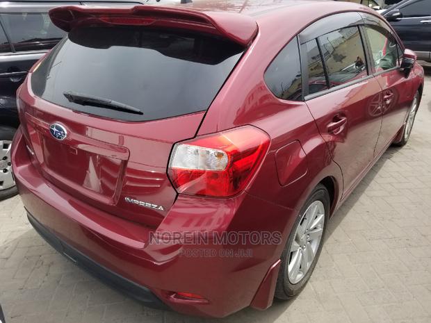 2014 Subaru Impreza in Red - Compact Sedan for Adventure
