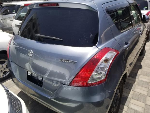 2014 Suzuki Swift in Blue: Compact Car, Perfect for You