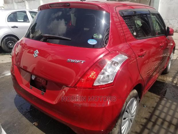 Red 2014 Suzuki Swift: Affordable Compact Car