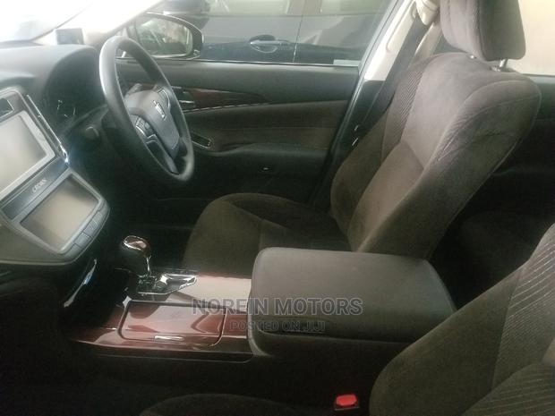 2014 Toyota Crown - Orange Hue: Ready for Adventure