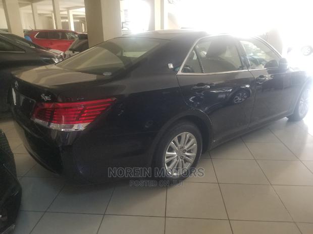2014 Toyota Crown - Orange Hue: Ready for Adventure