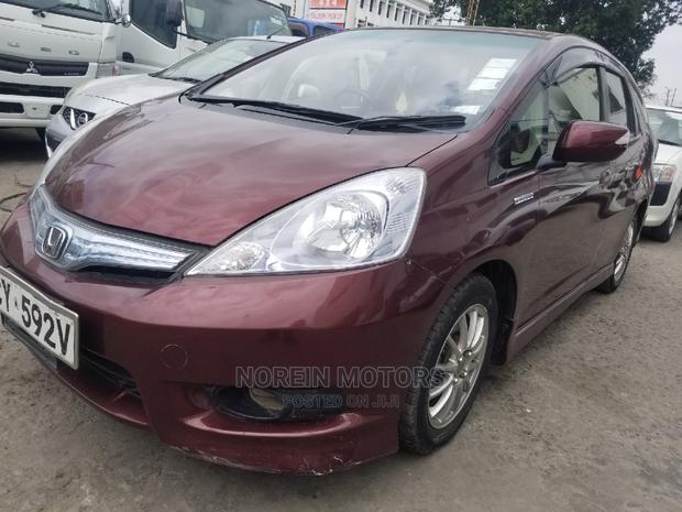 Red 2014 Honda Fit: Compact Car, Stylish Design