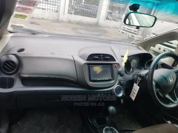 Red 2014 Honda Fit: Compact Car, Stylish Design