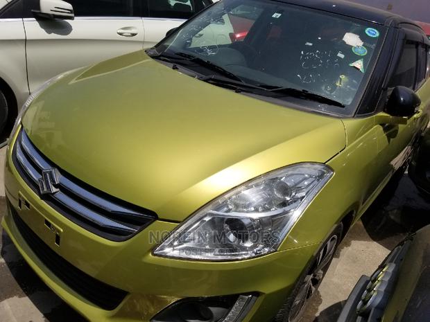 Gold 2014 Suzuki Swift: Compact Car with a Classic Look