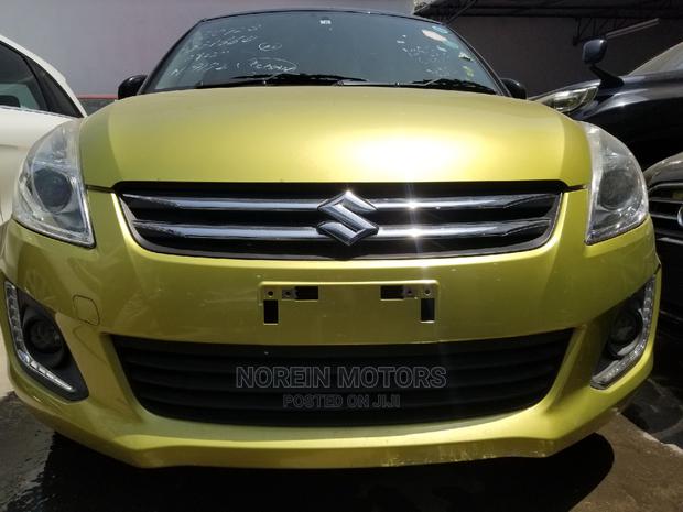 Gold 2014 Suzuki Swift: Compact Car with a Classic Look